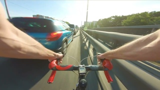 My way from work. Dangerous riding between cars on a road bike. Bicycle Commute