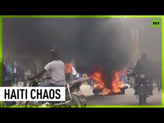 Hurling rocks & burning tires: Protests erupt over rising costs & insecurity in Haiti