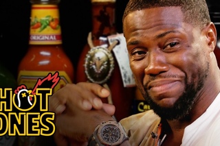 Kevin Hart eating spicy wings on Hot Ones